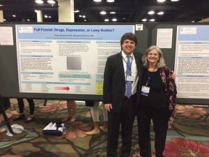 Dr. Adam Moskowitz poses with a proud Dr. Drickamer at his poster