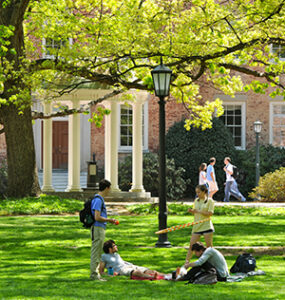 UNC Chapel Hill, the UNC MSTAR site. Students hanging out on the grass near the iconic Old Well.