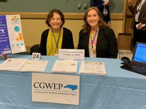 Dr. Ellen Roberts, PhD and Jennifer Hubbard seated at a table, representing the CGWEP at the 2023 AGS national meeting. 