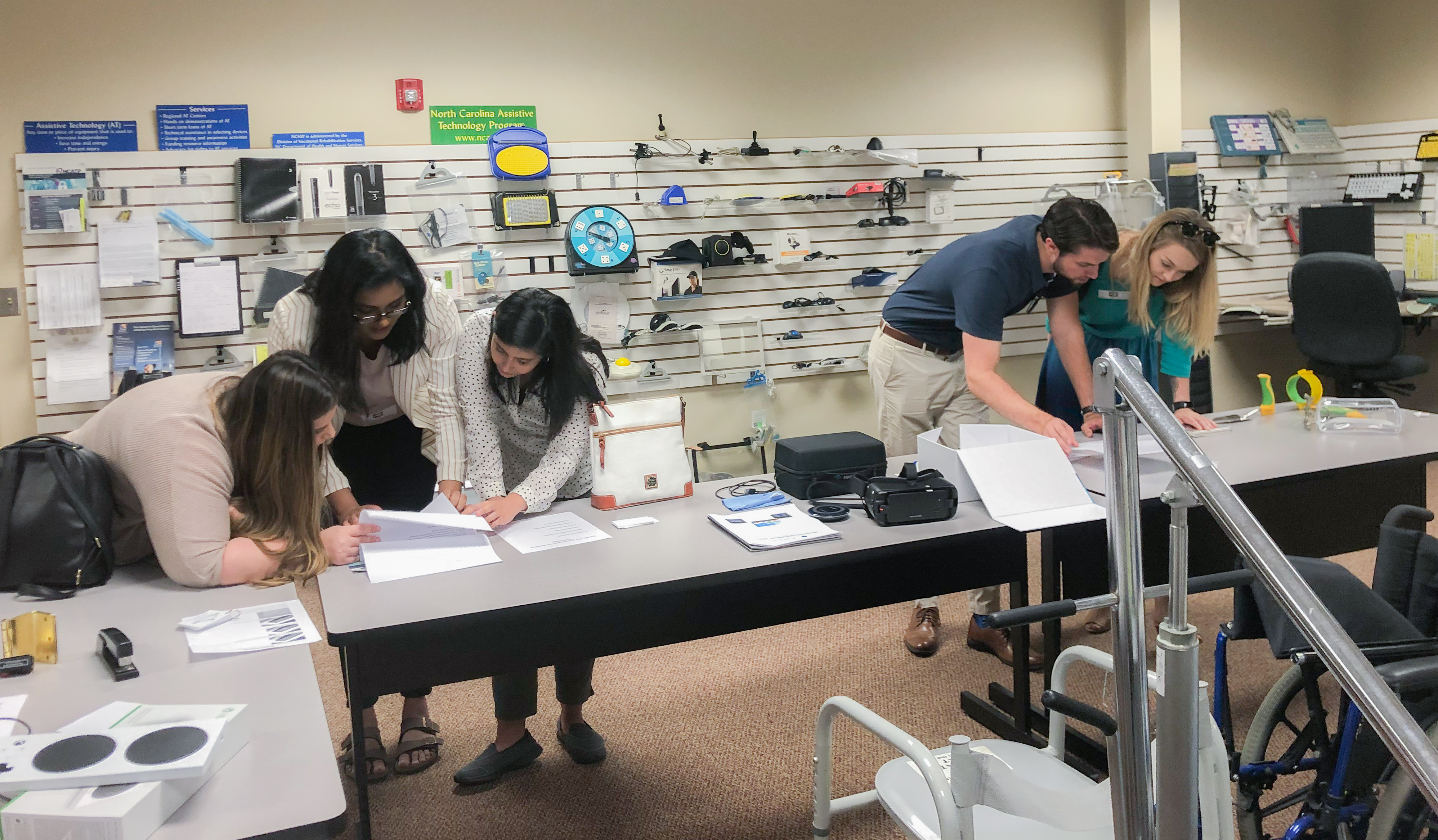 A group of RSA scholars work with assistive technology on their tour of vocational rehabilitation and community rehabilitation offices.