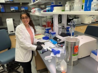 Undergraduate student, Simran Bhatia, performing an ELISA