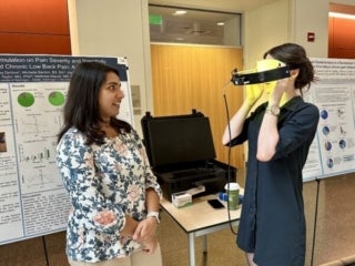 Linnstaedt Lab members visiting a poster presentation