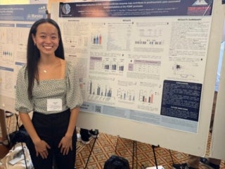 Amanda in front of her poster Celebration of Undergraduate Research