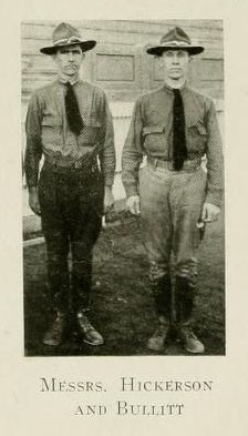 Black and white photograph of two men standing erect outside a building. They both wear a hat and tie. The caption says, "Messrs. Hickerson and Bullitt"