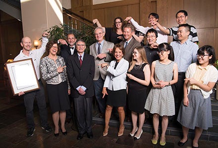 Dr. Aziz Sancar poses for a photo with Chancellor Carol L. Folt, colleagues and students after being award the O. Max Gardner Award by the UNC Board of Governors.