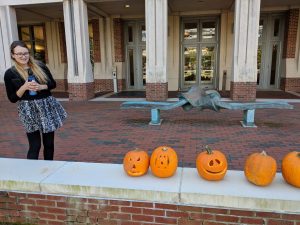 photo of graduate students with carved pumpkins in 2018