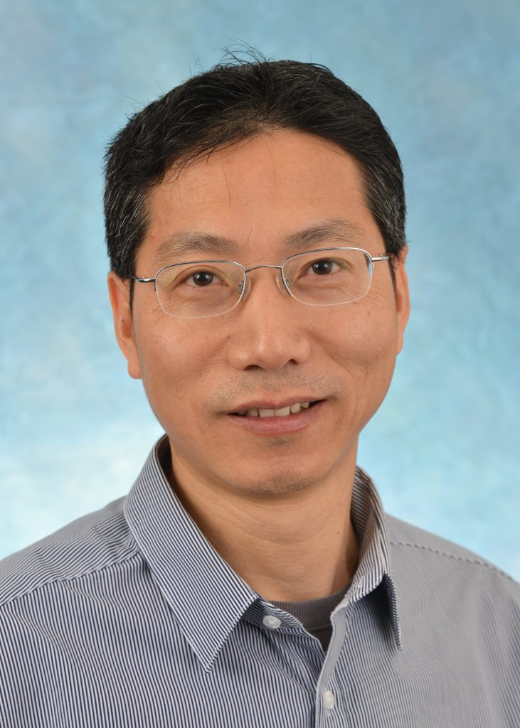 photo of Guochun Jiang PhD, Assistant Professor of Biochemistry and Biophysics Joint appointment in UNC HIV Cure Center (photo credit: Paul Braly of Tarheel Images)