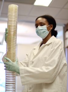 Najla Ward-Conyers undergrad holding items in a lab
