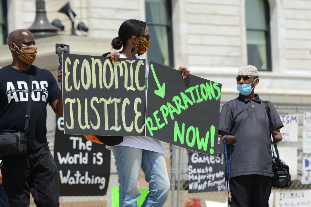 Hundreds gathered outside the Minnesota capitol building in St. Paul on June 19, 2020 to demand reparations from the United States government for years of slavery, Jim Crow, segregation, redlining, and violence against Black people from police.