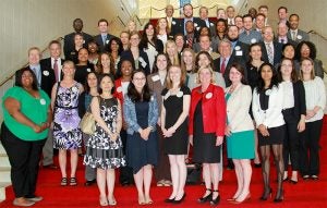 students standing with governor