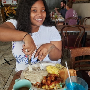 Martha S Johnson PhD eating food at a restaurant