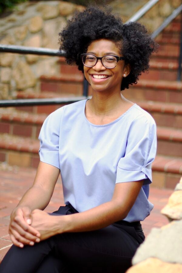 Nikea Pittman PhD with hands on knee