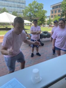 First-year Alex Neary tries his hand at flipping beakers. Pink team.