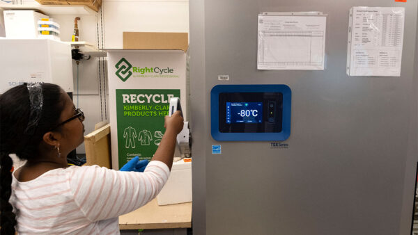 Research specialist Sonia Deochand from the Basta Lab opens a refrigeration unit housing biological samples in the Michael Hooker Research Center.