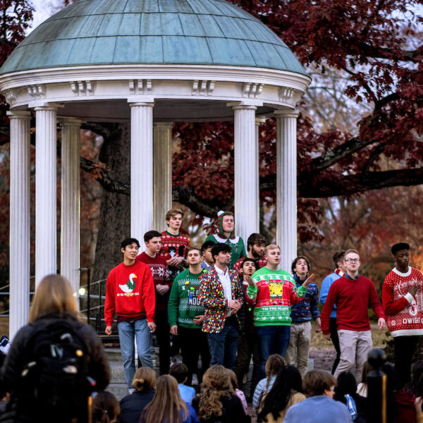 The student a cappella group, UNC Clef Hangers, perform at The Old Well at dusk on the last day of classes (LODOC) for the fall semester on the campus of the University of North Carolina at Chapel Hill, December 1, 2021. (Jon Gardiner/UNC-Chapel Hill)