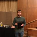 Garrett Chappell holding award