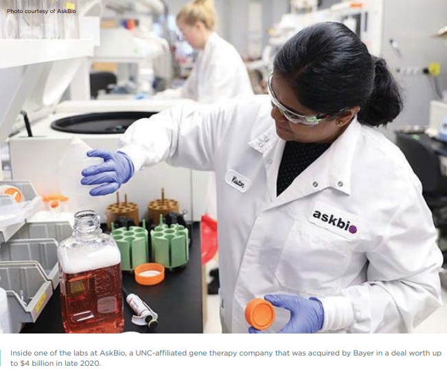 diverse scientist in lab setting - Inside one of the labs at AskBio, a UNC-affiliated gene therapy company that was acquired by Bayer in a deal worth up to $4 billion in late 2020.