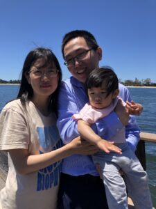 Liu Mei PhD with family outdoors