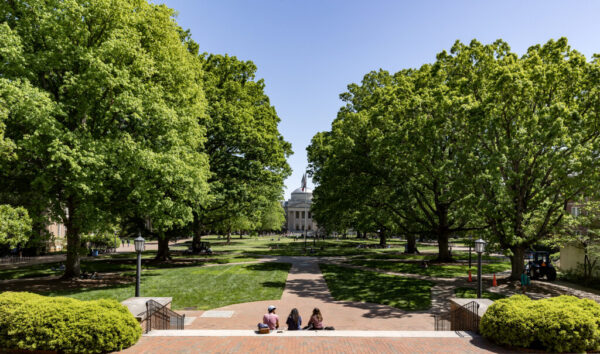 Students hang out on Polk Place with a view of Wilson Library on April 18, 2023, on the campus of the University of North Carolina at Chapel Hill. (Johnny Andrews/UNC-Chapel Hill)