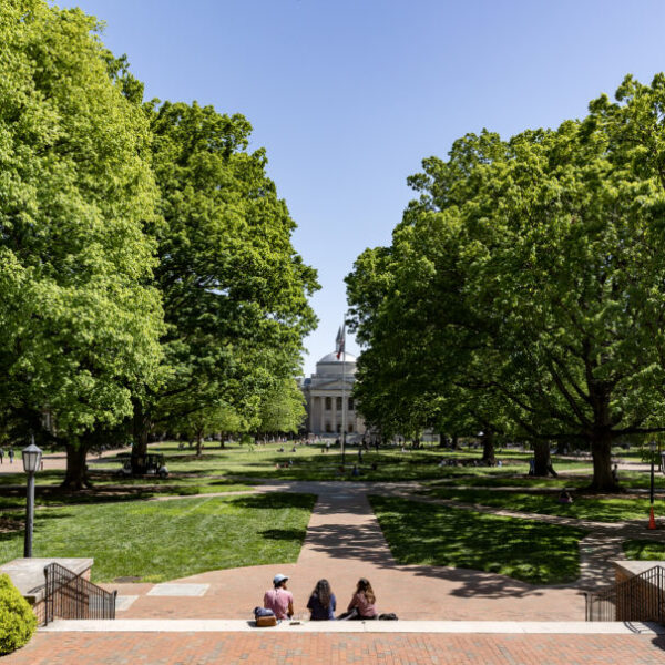 Students hang out on Polk Place with a view of Wilson Library on April 18, 2023, on the campus of the University of North Carolina at Chapel Hill. (Johnny Andrews/UNC-Chapel Hill)