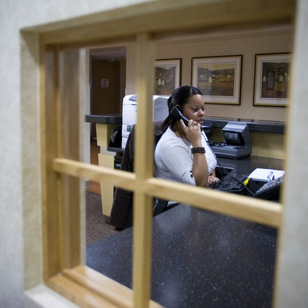 Woman on phone at desk