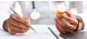 physician hands writing a prescription