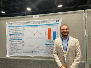 Ethan Rausch with research poster