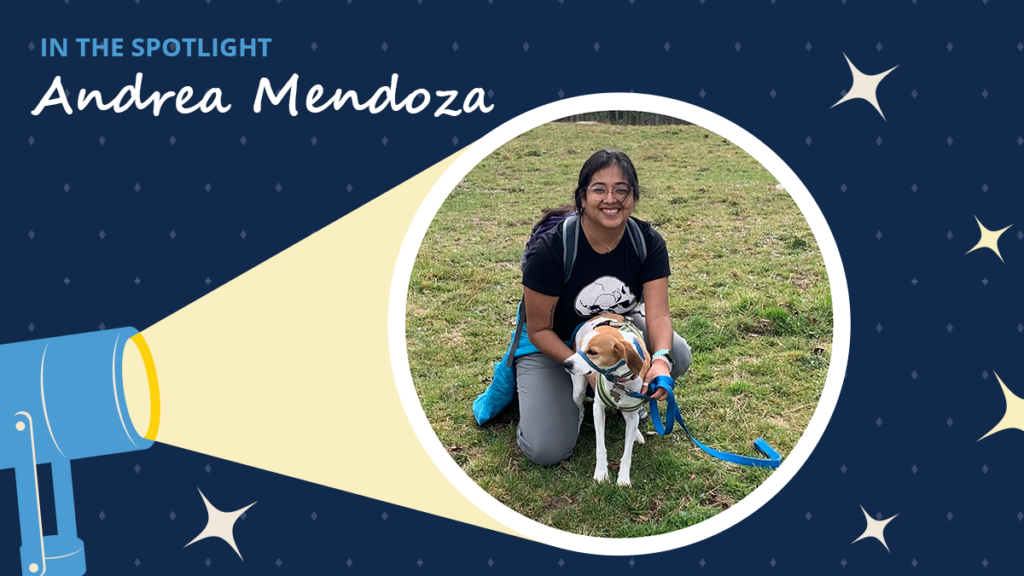 Navy blue background has diamons and starbursts. A spotlight icon shines on a circular image of Andrea Mendoza and her dog. A label read "In the spotlight." Below the label is the text "Andrea Mendoza."