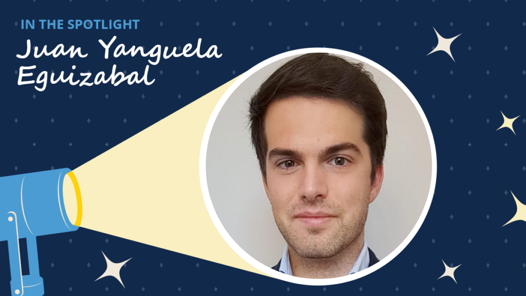 Navy blue background has diamons and starbursts. A spotlight icon shines on a circular headshot of Juan Yanguela Eguizabal. A label read "In the spotlight." Below the label is the text "Juan Yanguela Eguizabal."