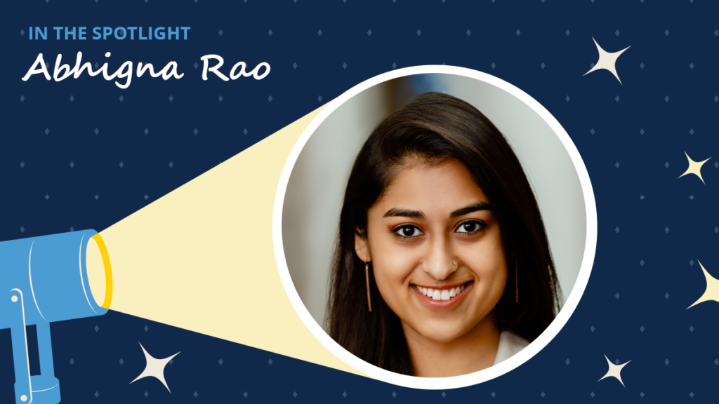 Navy blue background has diamonds and starbursts. A spotlight icon shines on a circular image of Abhigna Rao. A label reads "In the spotlight." Below the label is the text "Abhigna Rao."