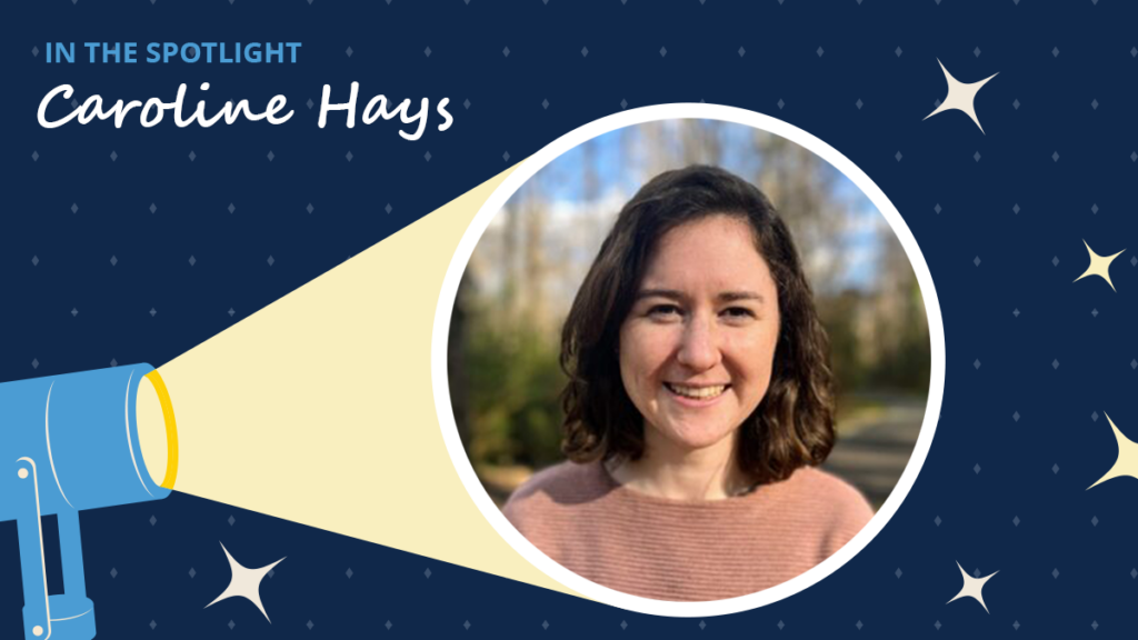 Navy blue background has diamonds and starbursts. A spotlight icon shines on a circular image of Caroline Hays. A label reads "In the spotlight." Below the label is the text "Caroline Hays."