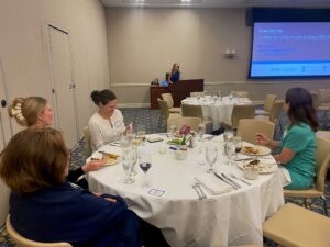 Christina Shenvi, MD speaking at APWIMS event