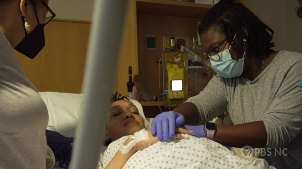 Doula Erika Lewis (right) assists childbirth on PBS NC episode