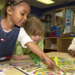 Children play together.