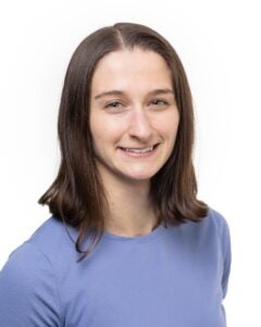 Kelsi Kazmierczak woman with shoulder length brown hair wearing a blue shirt 