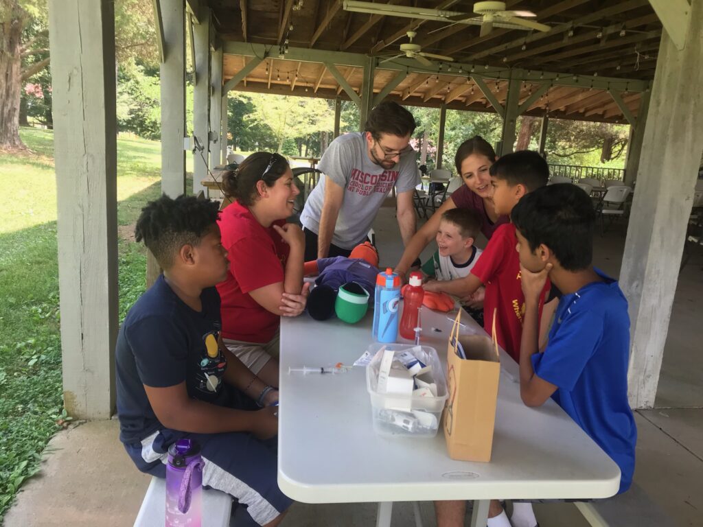 Campers having fun learning infusion and about joints with Bob the puppet