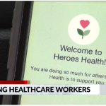The Heroes Health welcome screen is shown during a live television demonstration.