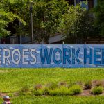 A large banner reads "Heroes Work Here"