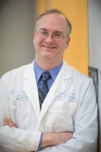 Headshot of Charles Esther