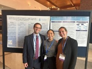 Charlie Roethling alongside classmates presenting research.