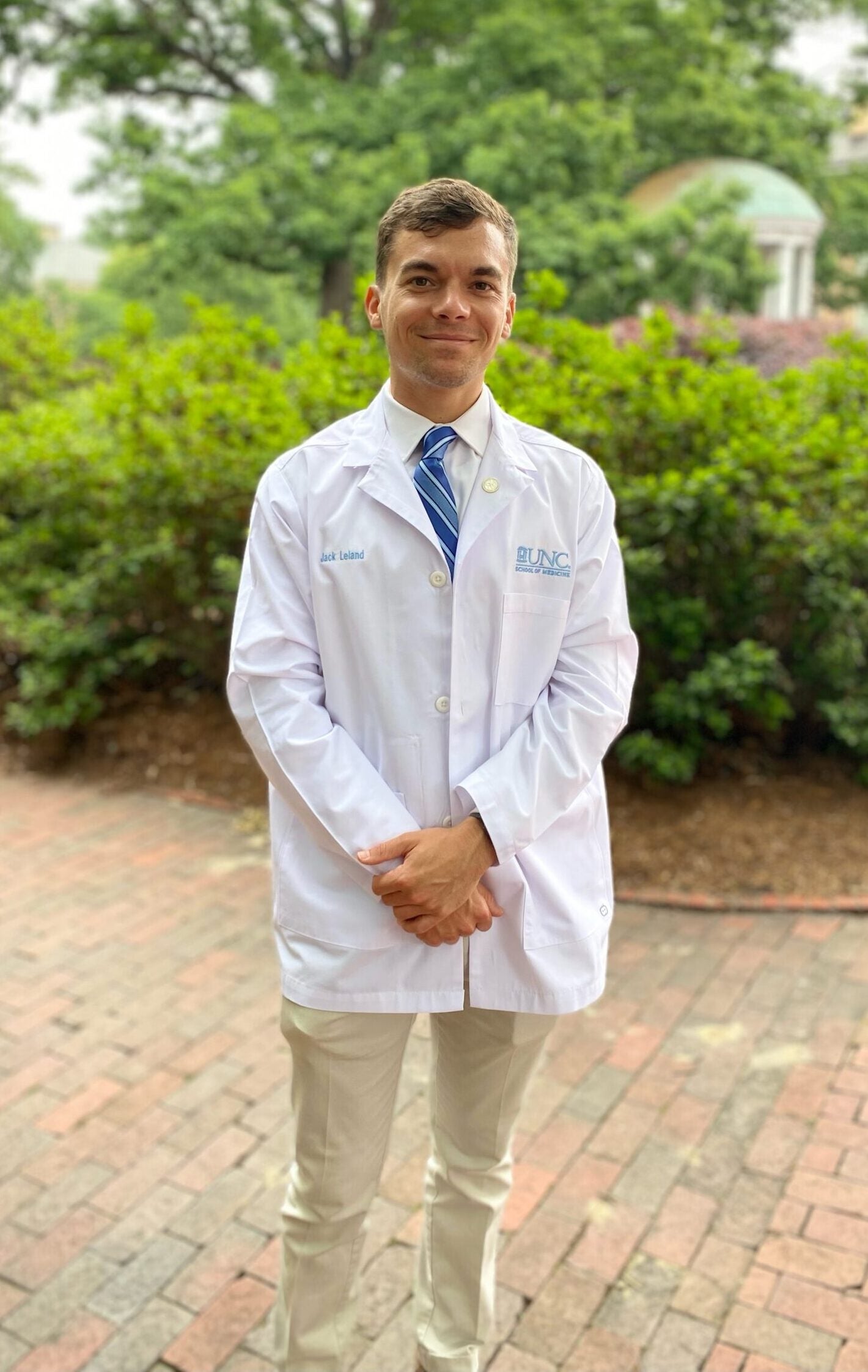 Jack Leland wearing his medical white coat.