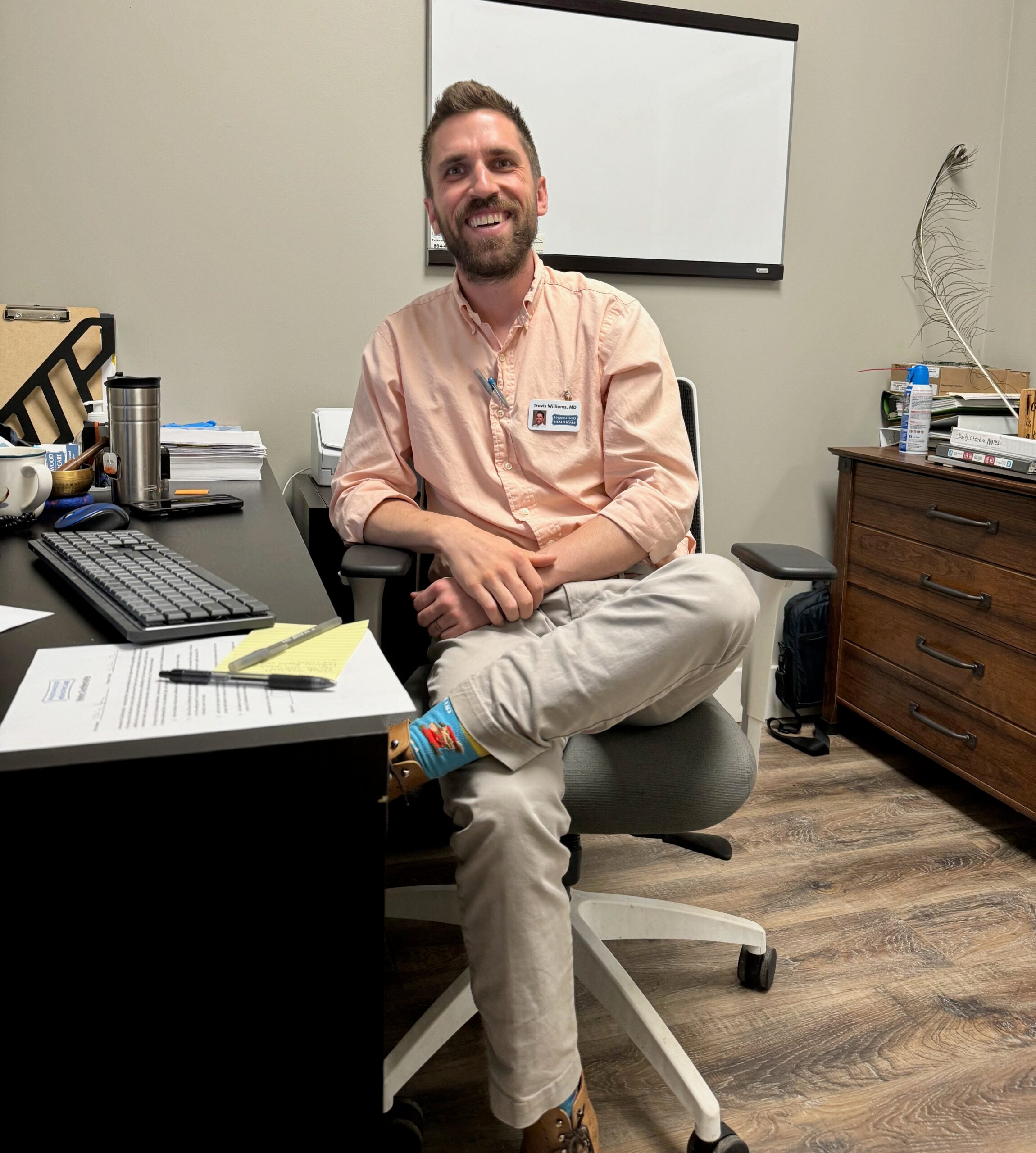 Dr. Travis Williams sitting at a desk