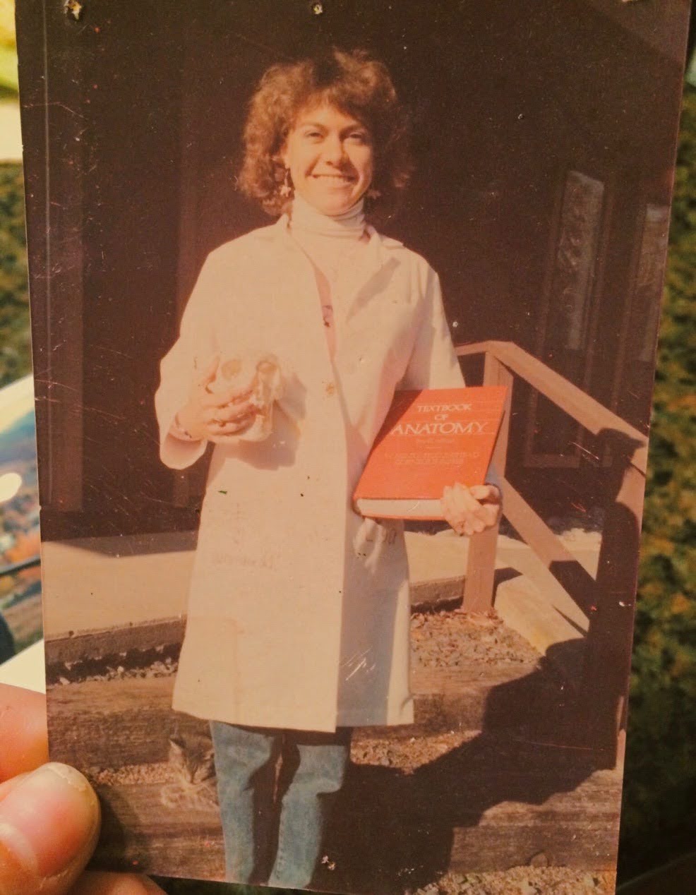 Lisa Sykes Leland carrying her medical textbook.