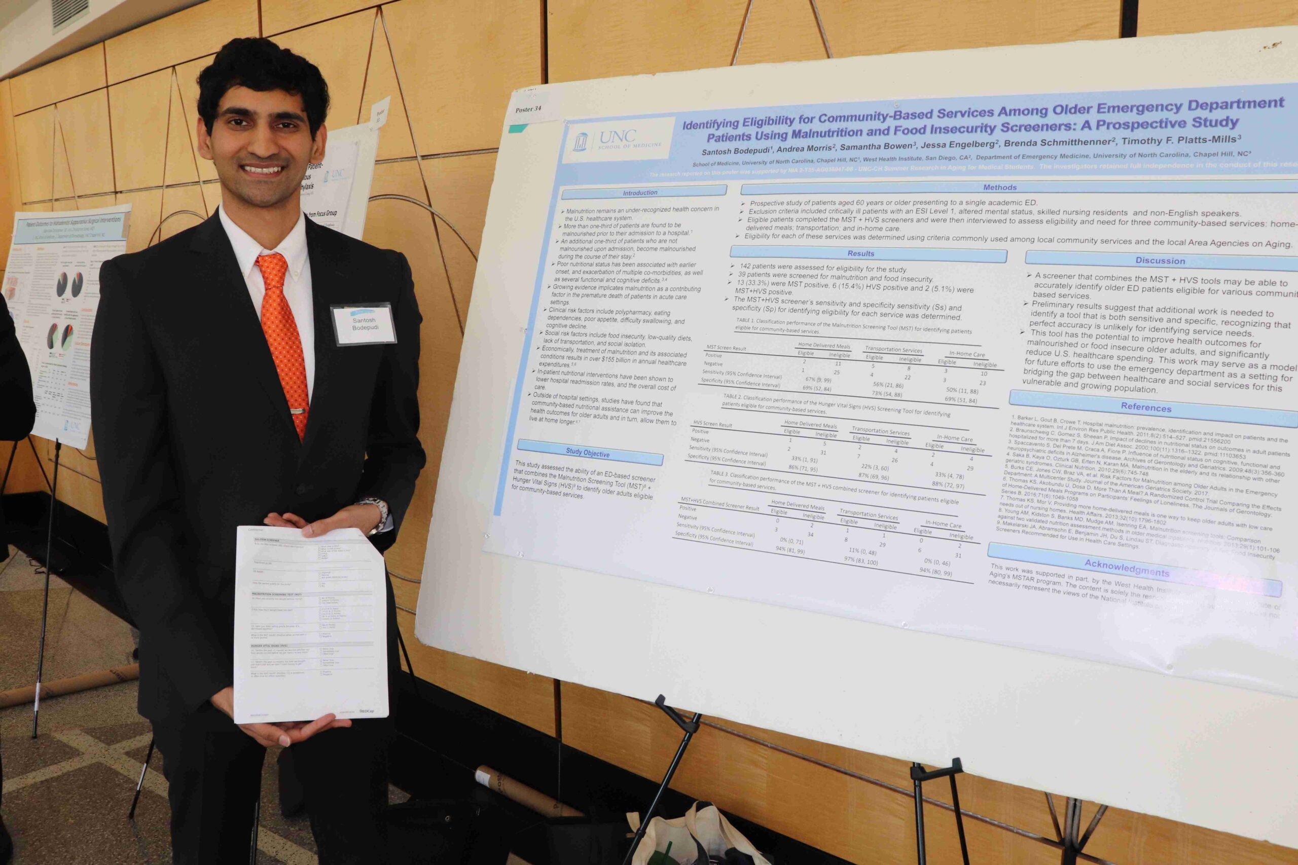 A UNC MSTAR student presenting his research in geriatric medicine at a conference.