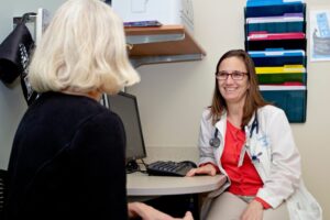 Dr. Speaking with Geriatrics patient