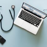 laptop and stethoscope for telehealth weight loss appointment
