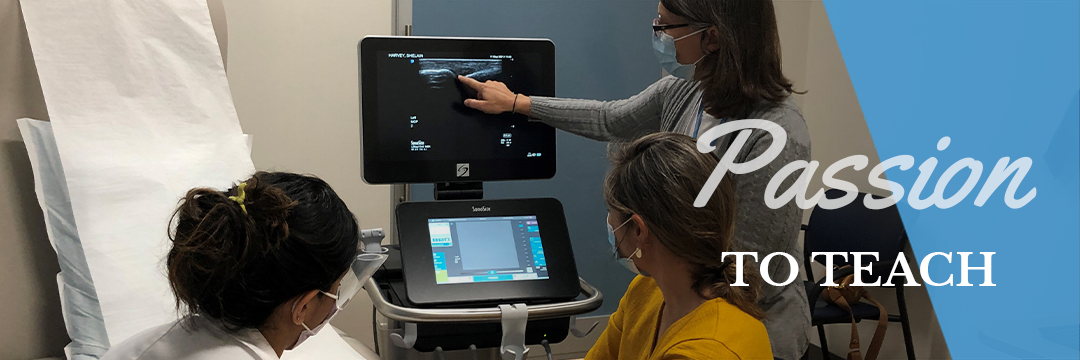 Medical teaching staff review images on an ultrasound machine