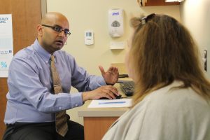 Dr. Sriram Machineni talks with a patient about her progress at the UNC Hospitals Diabetes and Endocrinology Clinic at Meadowmont.