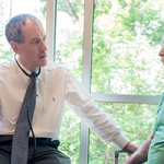 Peadar Noone, MD visits with a patient. Photo by Chris Polydoroff.
