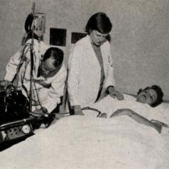 Dr. W.B. Blythe and Dr. Margaret Newton demonstrate use of the artificial kidney